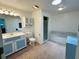 Bright bathroom boasts a single vanity, ample counter space, and separate tub and shower at 15069 Se 73Rd Ave, Summerfield, FL 34491