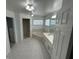 Bright Primary bathroom with tub, shower, double sinks and natural light at 15069 Se 73Rd Ave, Summerfield, FL 34491
