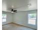 This bright bedroom offers natural light, fan and neutral walls, creating a relaxing ambiance at 15069 Se 73Rd Ave, Summerfield, FL 34491