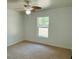 Bedroom featuring natural light, a ceiling fan, and windows with tranquil outdoor views at 15069 Se 73Rd Ave, Summerfield, FL 34491