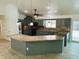Stylish kitchen featuring a breakfast bar, granite countertops, stainless steel appliances, and ample cabinet space at 15069 Se 73Rd Ave, Summerfield, FL 34491
