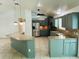 Well-lit kitchen boasting a breakfast bar, stainless steel appliances, and a functional layout at 15069 Se 73Rd Ave, Summerfield, FL 34491