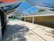 Long view of a screened-in pool area with the swimming pool and patio at 15069 Se 73Rd Ave, Summerfield, FL 34491