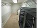 Spacious walk-in closet with ample shelving for optimal organization and storage solutions at 15069 Se 73Rd Ave, Summerfield, FL 34491