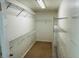 Walk-in closet featuring built-in shelving units to maximize your storage and organization at 15069 Se 73Rd Ave, Summerfield, FL 34491