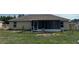 Backyard view of the screened porch and fencing at 15976 Sw 23Rd Court Rd, Ocala, FL 34473