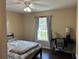 Cozy bedroom with a window view, desk, and comfortable sleeping area at 15976 Sw 23Rd Court Rd, Ocala, FL 34473