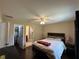Bright bedroom with ceiling fan, closet, and ensuite bathroom at 15976 Sw 23Rd Court Rd, Ocala, FL 34473