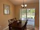 Cozy dining area adjacent to the kitchen with a view of the fenced backyard at 15976 Sw 23Rd Court Rd, Ocala, FL 34473