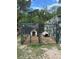A fenced dog kennel in the backyard with two dog houses for your pets at 15976 Sw 23Rd Court Rd, Ocala, FL 34473