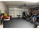 Garage with motorcycles, storage shelving and overhead garage door at 15976 Sw 23Rd Court Rd, Ocala, FL 34473