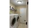 Laundry room featuring a washer and dryer with wire shelving at 15976 Sw 23Rd Court Rd, Ocala, FL 34473