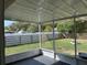 Screened in patio with vinyl privacy fence and green lawn at 15976 Sw 23Rd Court Rd, Ocala, FL 34473