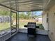 Enjoy the view from this screened in porch with dark tile and access to the yard at 15976 Sw 23Rd Court Rd, Ocala, FL 34473