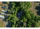 Aerial view of home surrounded by mature trees offering lots of privacy at 16571 Se 95Th Street Rd, Ocklawaha, FL 32179