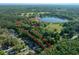 Aerial view of the property boundary, showing its location in relation to the lake and surrounding woods at 16571 Se 95Th Street Rd, Ocklawaha, FL 32179