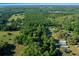 Scenic aerial view showing the abundance of mature trees at 16571 Se 95Th Street Rd, Ocklawaha, FL 32179
