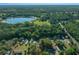 Aerial view of home with a locator pin showing where the property is located near a lake at 16571 Se 95Th Street Rd, Ocklawaha, FL 32179