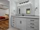 Updated bathroom vanity with modern fixtures and view of adjacent bedroom at 16571 Se 95Th Street Rd, Ocklawaha, FL 32179