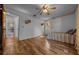 Bedroom featuring hardwood floors, ceiling fan, with adjoining bathroom and closet space at 16571 Se 95Th Street Rd, Ocklawaha, FL 32179