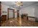 Bedroom featuring hardwood floors, ceiling fan, large closet, and neutral colored walls at 16571 Se 95Th Street Rd, Ocklawaha, FL 32179