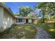 Charming single-story home with a pathway leading to the entrance and a well-maintained yard at 16571 Se 95Th Street Rd, Ocklawaha, FL 32179