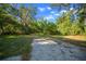 A large lot provides ample space and features mature trees, enhancing the property's natural beauty at 16571 Se 95Th Street Rd, Ocklawaha, FL 32179