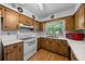 Well-lit kitchen featuring white appliances and ample counter space at 16571 Se 95Th Street Rd, Ocklawaha, FL 32179