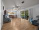 Combined living and dining area leading to a screened patio at 16571 Se 95Th Street Rd, Ocklawaha, FL 32179