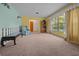 Bright living room with large windows and view of outdoor greenery at 16571 Se 95Th Street Rd, Ocklawaha, FL 32179