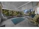 Spacious screened porch with comfortable seating area, perfect for relaxing outdoors at 16571 Se 95Th Street Rd, Ocklawaha, FL 32179