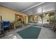 Inviting screened porch with comfortable seating, creating a seamless transition to the outdoors at 16571 Se 95Th Street Rd, Ocklawaha, FL 32179
