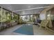 Comfortable screened porch with view of the backyard and plenty of room to relax at 16571 Se 95Th Street Rd, Ocklawaha, FL 32179