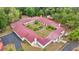 Aerial view shows large courtyard in the center of the U-shaped home with a red roof at 16891 Ne 243Rd Place Rd, Fort Mc Coy, FL 32134