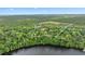 Sprawling wooded acreage with water frontage; the property is outlined in white to showcase its boundaries at 16891 Ne 243Rd Place Rd, Fort Mc Coy, FL 32134