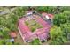 Aerial view of unique home featuring an enclosed courtyard and outbuildings at 16891 Ne 243Rd Place Rd, Fort Mc Coy, FL 32134