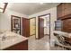 A bathroom with a double vanity, tile flooring, and a separate grooming area at 16891 Ne 243Rd Place Rd, Fort Mc Coy, FL 32134