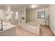 Bathroom with tub, sink, and tile at 16891 Ne 243Rd Place Rd, Fort Mc Coy, FL 32134