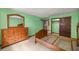 A bright bedroom with wooden furniture and tile flooring at 16891 Ne 243Rd Place Rd, Fort Mc Coy, FL 32134