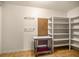 Functional closet with multiple shelves, racks and a moveable small table at 16891 Ne 243Rd Place Rd, Fort Mc Coy, FL 32134