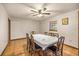 Bright dining room with tile floors, ceiling fan, and traditional dining set at 16891 Ne 243Rd Place Rd, Fort Mc Coy, FL 32134