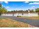 Side exterior of this home showing the garage and driveway at 16891 Ne 243Rd Place Rd, Fort Mc Coy, FL 32134