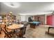 Game room features a pool table, a brick fireplace, and comfortable seating at 16891 Ne 243Rd Place Rd, Fort Mc Coy, FL 32134