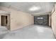 Spacious garage with concrete floor and rolling door at 16891 Ne 243Rd Place Rd, Fort Mc Coy, FL 32134