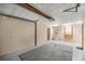 Large garage featuring a storage area and exterior door at 16891 Ne 243Rd Place Rd, Fort Mc Coy, FL 32134