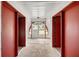 Spacious hallway with sleek floors, high ceilings, and a clear view to the beautifully landscaped backyard at 16891 Ne 243Rd Place Rd, Fort Mc Coy, FL 32134