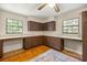 The kitchen features wood cabinets, a long counter, and is naturally well-lit at 16891 Ne 243Rd Place Rd, Fort Mc Coy, FL 32134