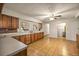 Functional kitchen with wood cabinets and lots of counter space, open to dining area at 16891 Ne 243Rd Place Rd, Fort Mc Coy, FL 32134