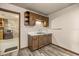 Convenient kitchenette with cabinets, sink, and adjacent storage offers practicality and ease of access at 16891 Ne 243Rd Place Rd, Fort Mc Coy, FL 32134
