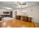 Spacious living room has tile flooring, ceiling fans and built-in desk area at 16891 Ne 243Rd Place Rd, Fort Mc Coy, FL 32134